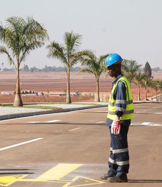 ZIMBABWE-HARARE-SADC-ROADS-UPGRADE (240721) -- HARARE, July 21, 2024 (Xinhua) -- A worker prints lane direction markings on a newly constructed road on the outskirts of Zimbabwe's capital Harare, on July 20, 2024. Zimbabwe is upgrading roads in and around Harare ahead of an August summit of the Southern African Development Community (SADC) in the capital city. (Photo by Tafara Mugwara/Xinhua)